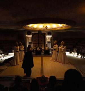 a group of people on a stage in a room
