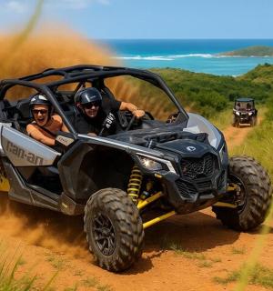 due persone in sella a un quad su una strada sterrata