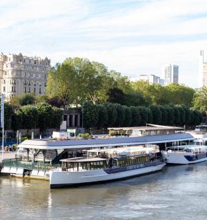 a group of boats are docked in a river