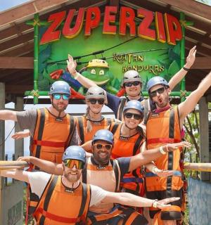 a group of men in orange uniforms posing for a picture
