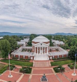 an aerial view of a building with a flag