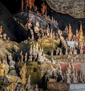 a cave filled with lots of statues in a cave