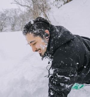 a man is standing in the snow