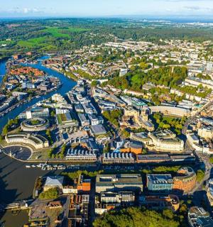 an aerial view of a city with a river