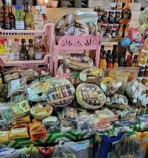 a display of food and bottles of wine in a store