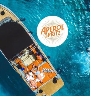 a group of people in a small boat in the water