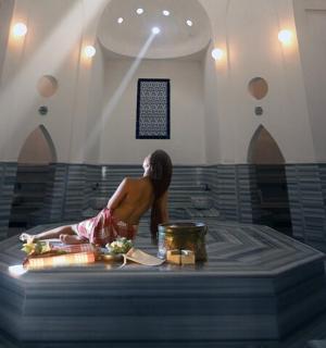 a woman sitting at a table in a room