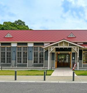 a building with a red roof on a street