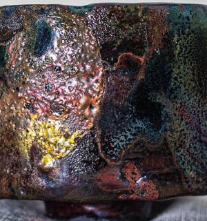 a brown object with many different colored metals