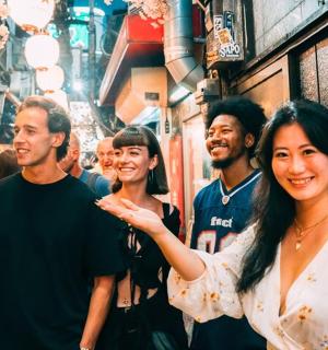a group of people walking down a street