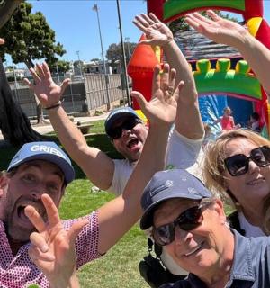 a group of people with their hands in the air