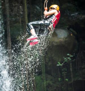 a person is doing a trick on a water board
