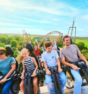 a group of people riding on an roller coaster