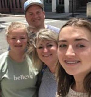 a man and two women posing for a picture