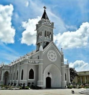 a large white building with a clock tower on it