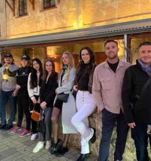 a group of people standing in front of a building