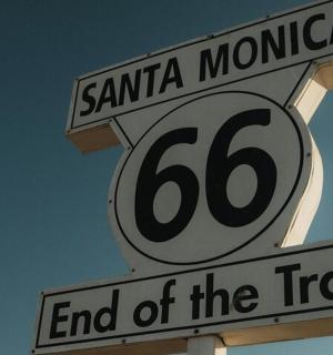 a street sign for santa monica and end of the trail
