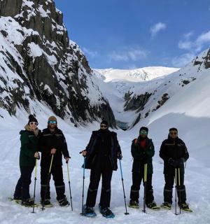 a group of people on skis standing in the snow