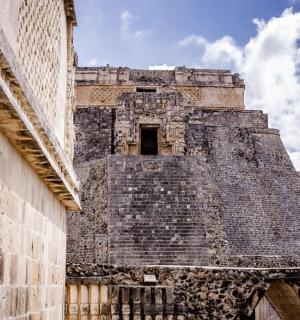 a tall building with a tower in the distance
