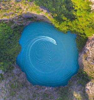 an aerial view of a large blue pool of water