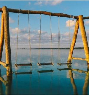 a pole in the middle of a body of water