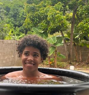 a young boy is in a hot tub