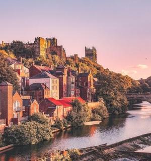 a view of a city with a bridge and a river