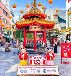 a street with a pagoda in the middle of a city