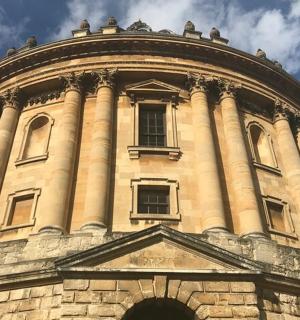 a large stone building with a round top