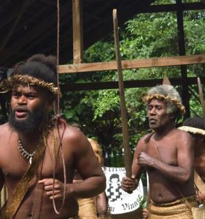 a group of men in costumes standing in a group