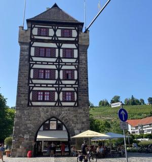 a tall building with a clock tower in a town
