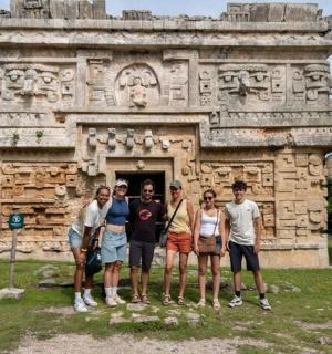 a group of people standing in front of a building