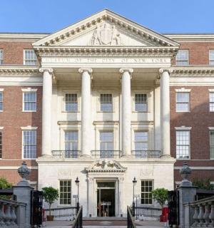 a large red brick building with a large doorway
