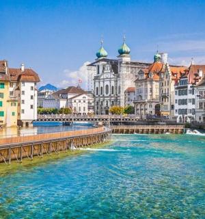 a river in the middle of a city with buildings