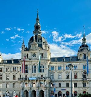 a large building with a blue sky in the background