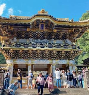 a group of people standing on steps in front of a building