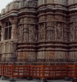 a large building with a fence in front of it