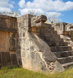 an old stone wall with a set of stairs