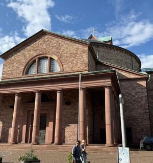 a large brick building with pillars in front of it