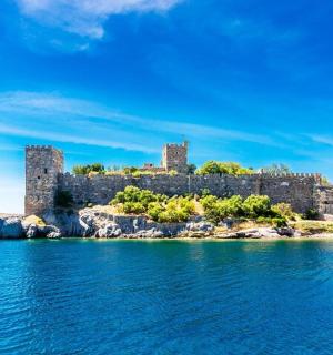an old castle on an island in the water