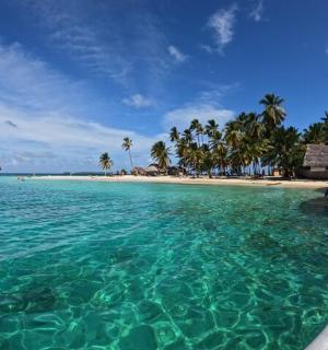 a view of a beach with a boat in the water