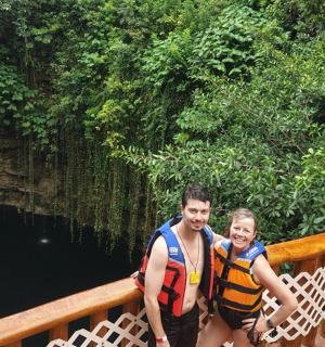 a man and a child standing on a bridge