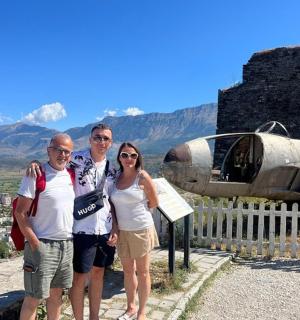 a group of people standing on top of a mountain