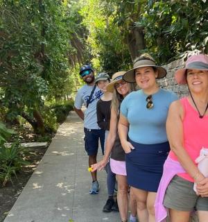 a group of people walking down a path