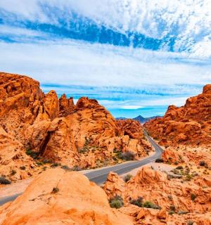 a road in the desert with red rocks
