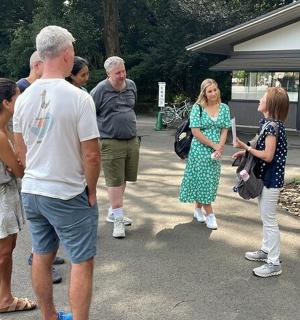 a group of people standing in a parking lot