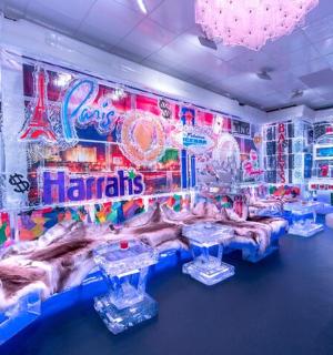 a room with a party with tables and neon lights