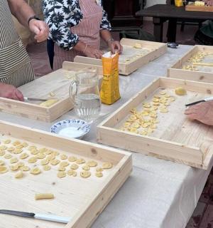 a group of people preparing food on a table
