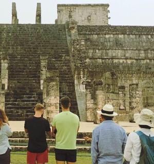 a group of people standing in front of a building