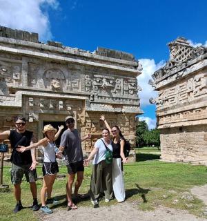a group of people standing in front of a building